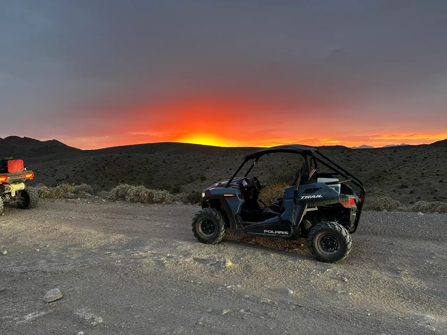 Polaris RZR sand buggy against a fiery Sonoran Desert sunset on the Scottsdale sunset tour
