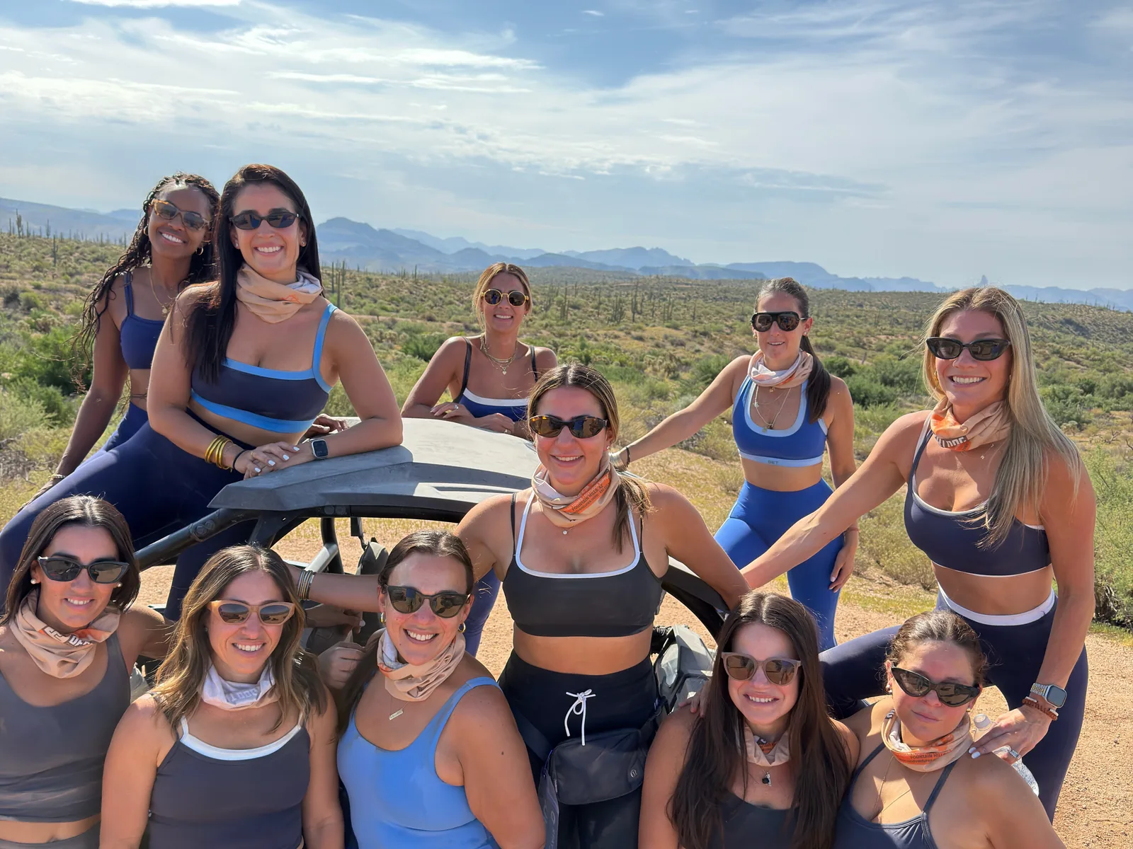 Bachelorette party in blue gathered on their off-road buggy in the Sonoran Desert near Scottsdale